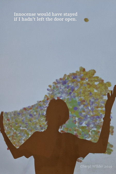 silhouette of young man with his arms cradling colorful balls on a digital screen